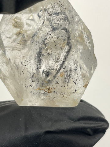 enhydro crystal with bubble inside of crystal held by hand